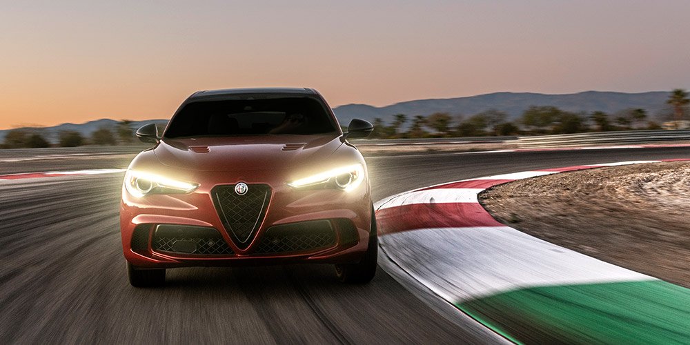 Red Stelvio QV driving on a track